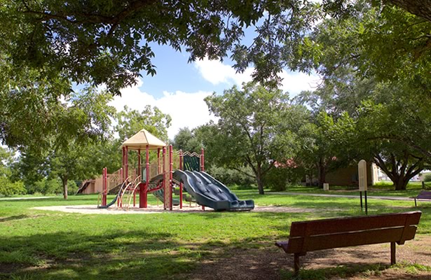 Playground and seating at Pecan Park